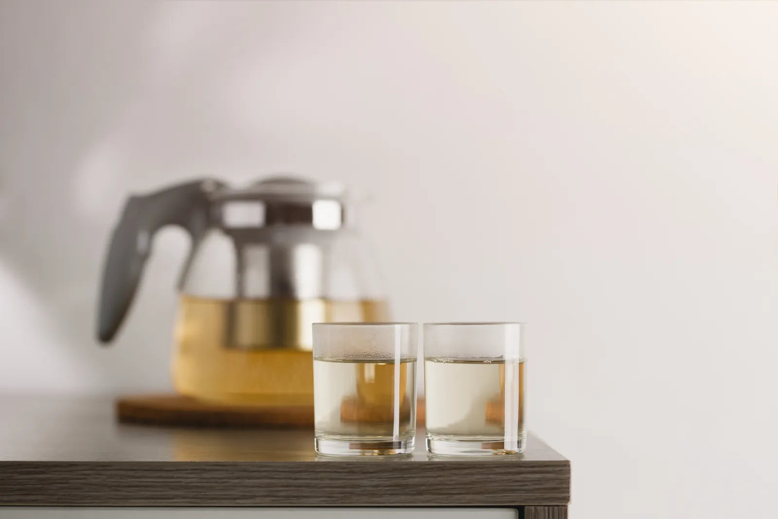 Two glasses of filtered water, ideal for consistent homebrewing beer quality.