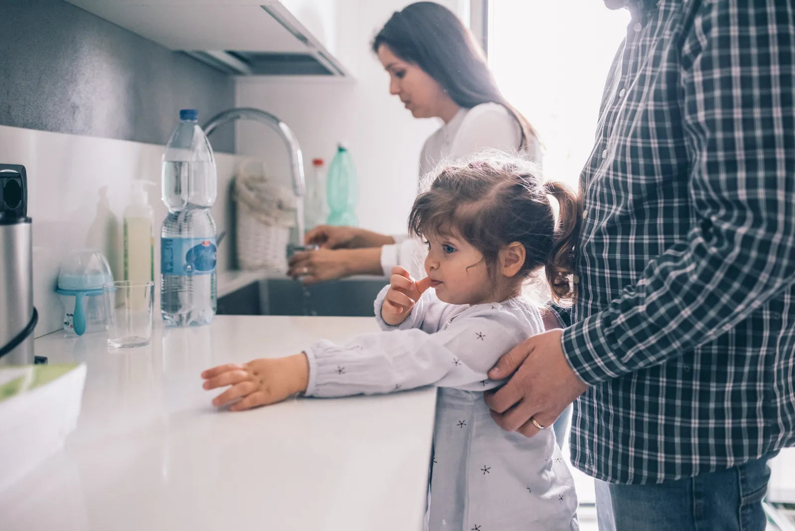 A family uses clean, filtered water in the kitchen for their taste-sensitive child.