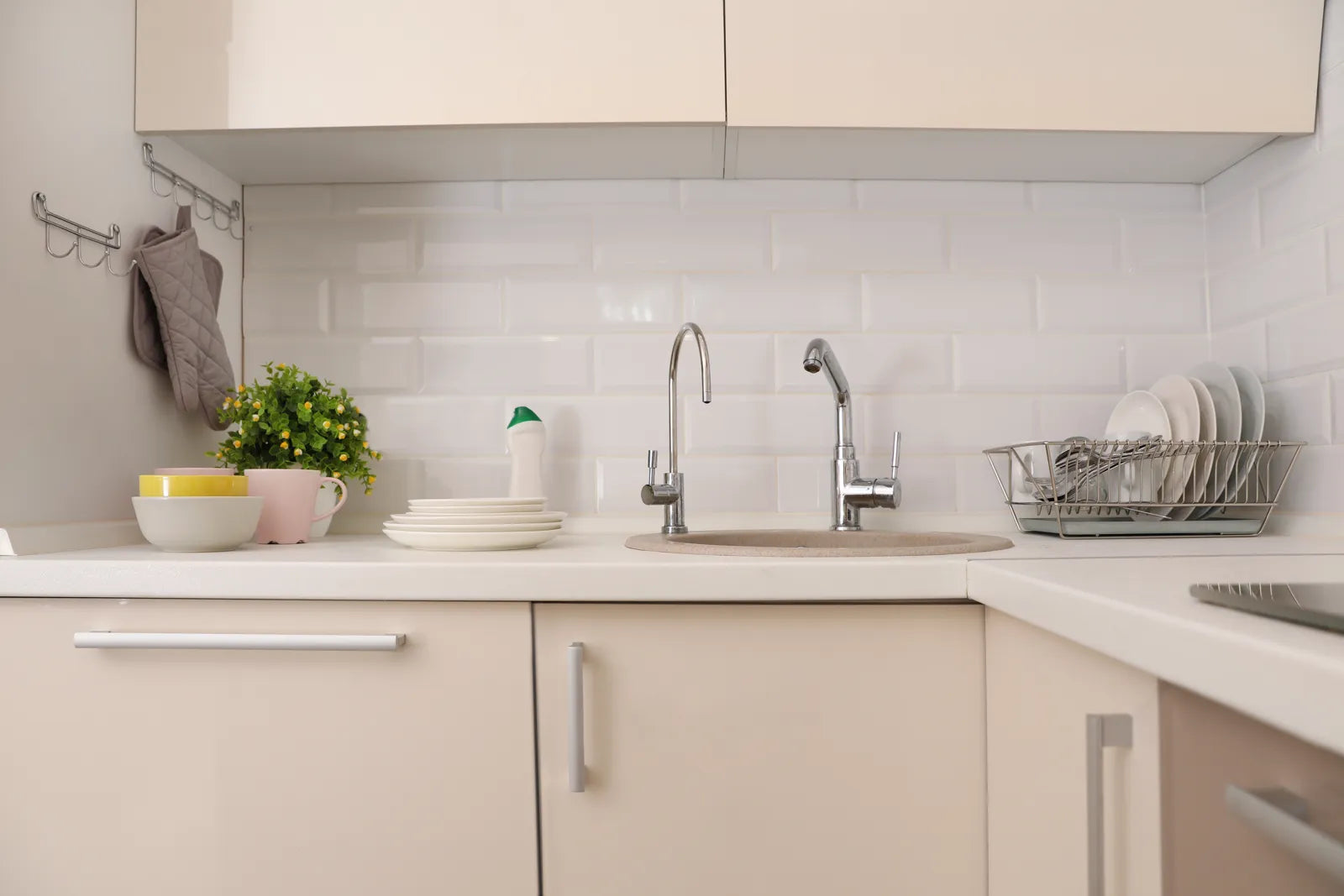 A small kitchen sink area shows where a compact RO system fits perfectly.
