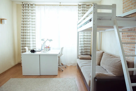 A bright compact dorm bedroom offers ideal space for a portable dorm water filter setup.